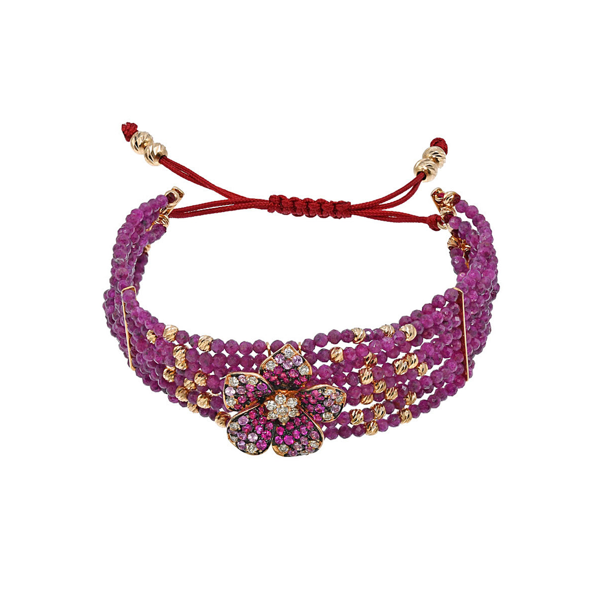18K Gold bracelet with diamonds and rubies. Thje flower is surrounded by ruby and gold beads. 