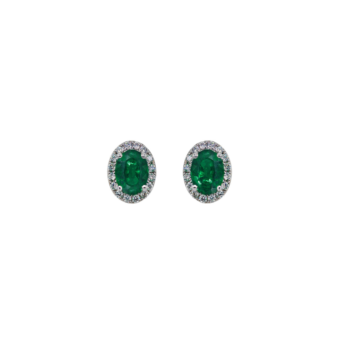 Emerald and diamond earrings. Oval shape emerald earrings