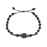 A unique square sapphire bracelet with black gold beads and onyx beads.