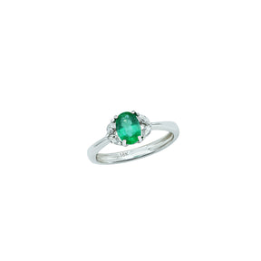 Oval Emerald ring with four white diamonds 